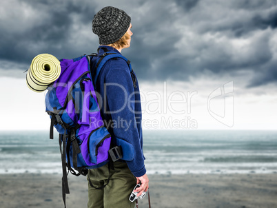 Composite image of side view of backpacker hipster