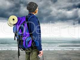Composite image of side view of backpacker hipster