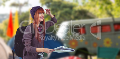 Composite image of smiling hipster woman with a map