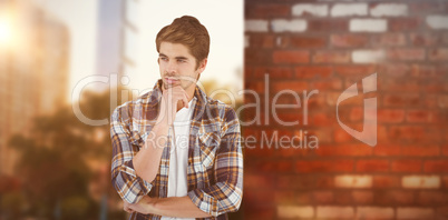 Composite image of confident businessman standing with hand on c