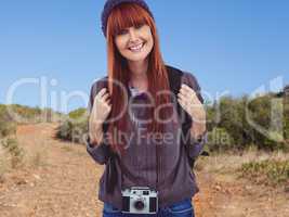 Composite image of portrait of a smiling hipster woman with a re