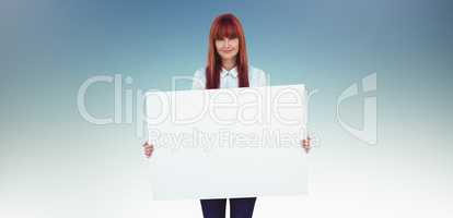 Composite image of attractive hipster woman holding white card