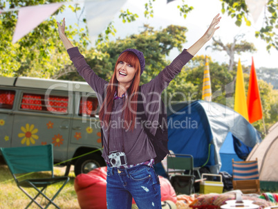 Composite image of smiling hipster woman with hands up