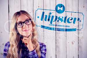 Composite image of gorgeous smiling blonde hipster daydreaming