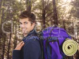 Composite image of side view of happy man with backpack