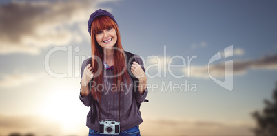 Composite image of portrait of a smiling hipster woman with a re