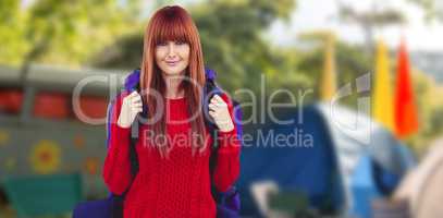 Composite image of smiling hipster woman with a travel bag takin