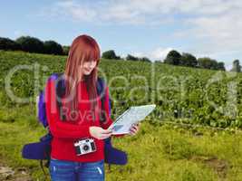 Composite image of smiling hipster woman with a travel bag with