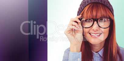 Composite image of smiling hipster woman looking at camera