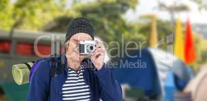 Composite image of backpacker hipster taking pictures with a ret