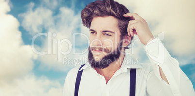Composite image of hipster scratching head while thinking