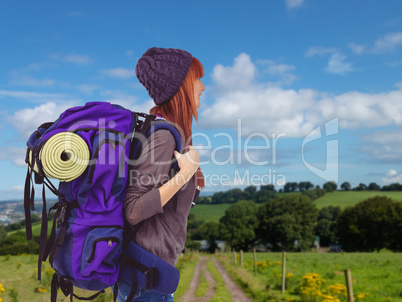 Composite image of side view of a hipster woman with a travel ba