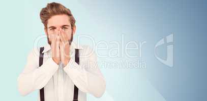 Composite image of portrait of hipster with hands covering mouth