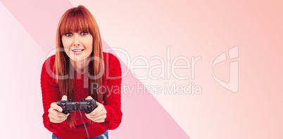 Composite image of smiling hipster woman playing video games