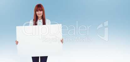 Composite image of attractive hipster woman holding white card