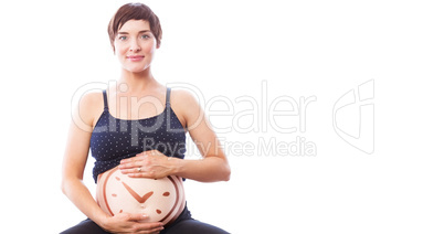 Composite image of portrait of happy pregnant woman holding bell