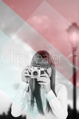 Composite image of attractive hipster photographing with camera