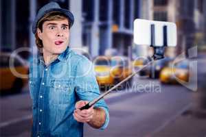 Composite image of funny hipster taking picture