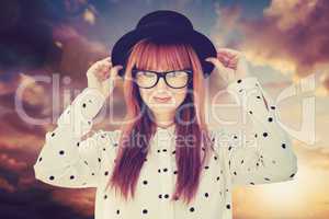 Composite image of attractive smiling hipster woman with hat