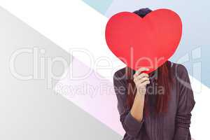 Composite image of hipster woman behind a red heart