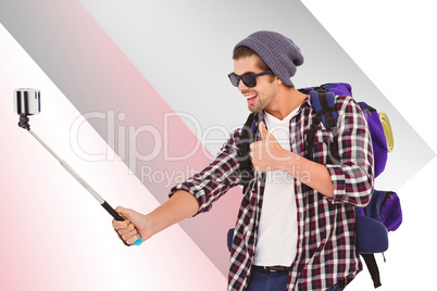 Composite image of happy man taking selfie