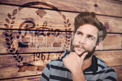 Composite image of close-up of thoughtful hipster with hand on c