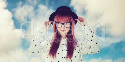 Composite image of attractive smiling hipster woman with hat