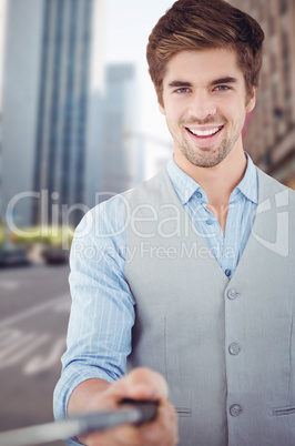 Composite image of portrait of happy businessman holding selfie