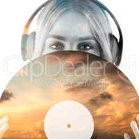 Composite image of portrait of a beautiful woman holding a vinyl