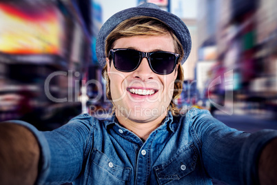 Composite image of crazy hipster wearing sunglasses