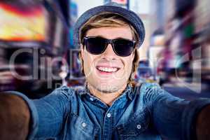 Composite image of crazy hipster wearing sunglasses