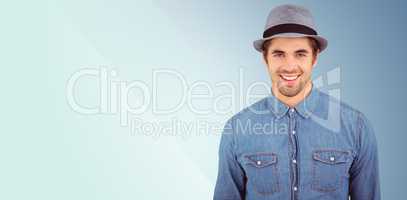Composite image of portrait of happy hipster wearing hat
