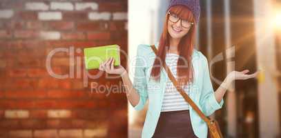 Composite image of smiling hipster woman with bag and book