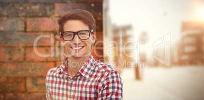 Composite image of young businessman smiling