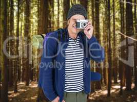 Composite image of backpacker hipster taking pictures with a ret