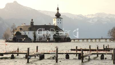 Lake Traunsee and Schloss Castle Ort in Upper Austria on a warm spring morning