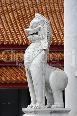 Traditional stone dragon statues. Grand Palace, Bangkok.