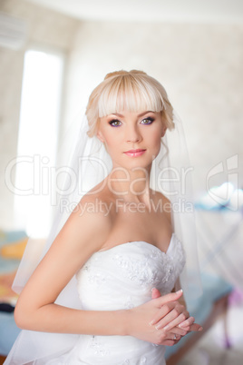 Blonde bride in white dress