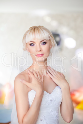 Blonde bride in white dress