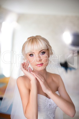 Blonde bride in white dress