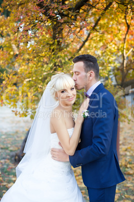 The groom gently hugged the bride