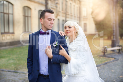 The groom gently hugged the bride