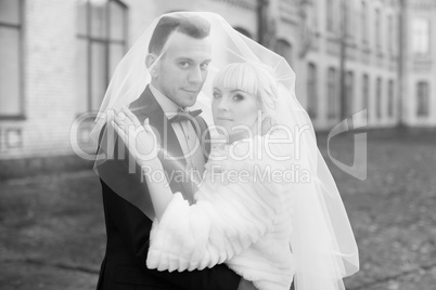 The groom gently hugged the bride