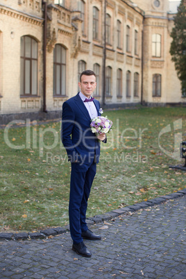 Confident bride in an expensive suit