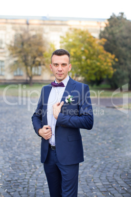 Confident bride in an expensive suit