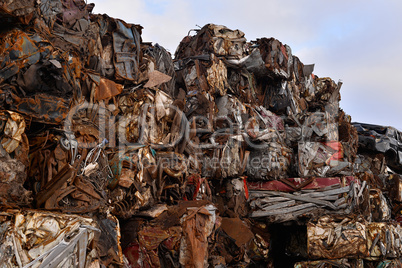 A pile of compressed cars in blocks for processing