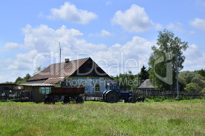 Rural summer landscape with the image of the old village