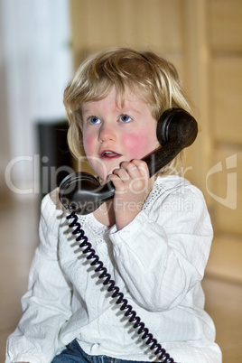 Little girl with telephone