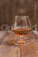 Brandy Glass on a wooden background