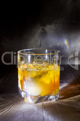 Glass of whiskey with ice